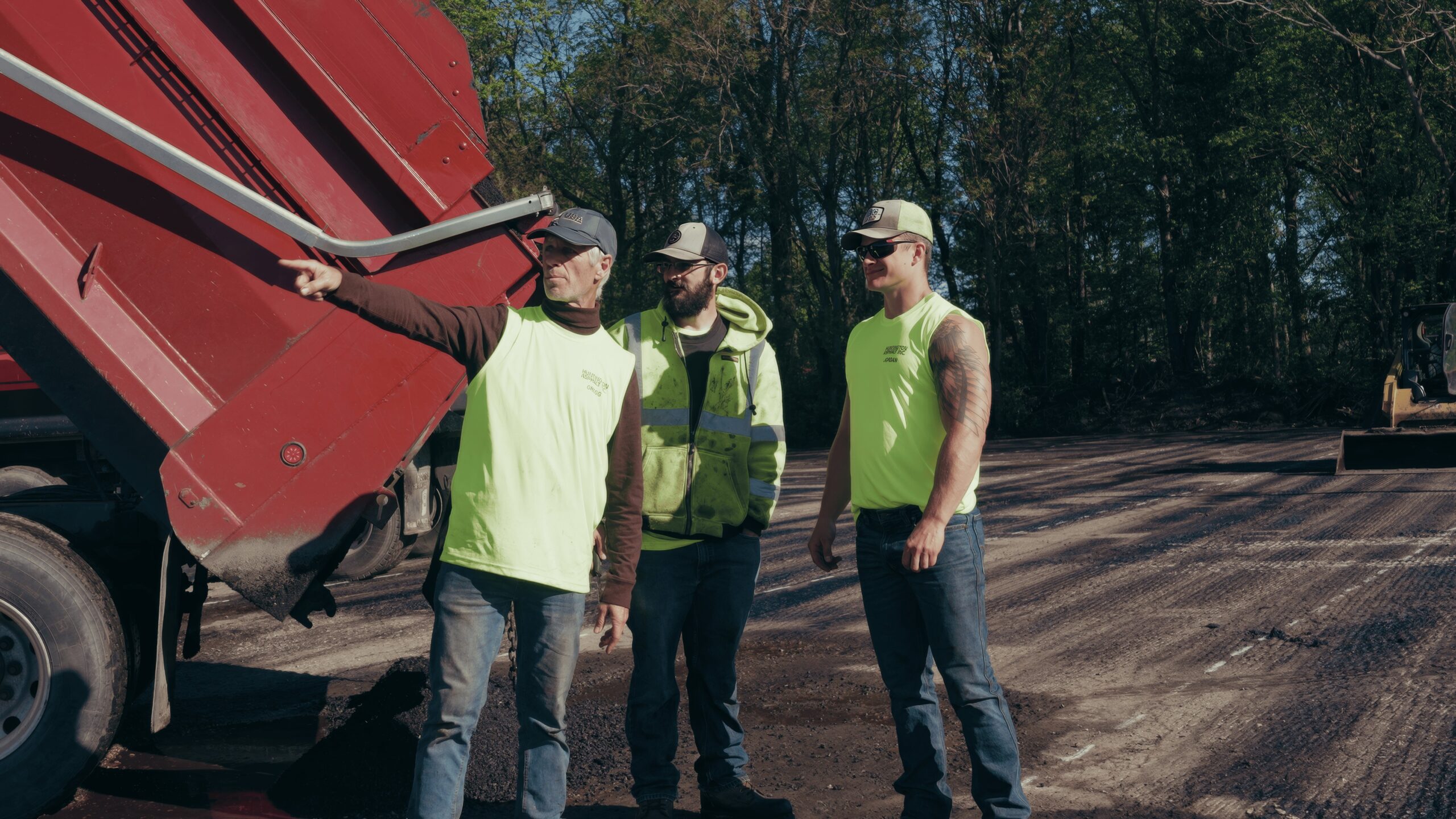 Gregg Ness, owner of Huntington Asphalt, overseeing a paving project